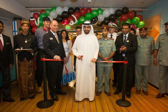 Guest of Honour His Highness Sheikh Mohammed bin Humaid Al Qasimi cuts a ribbon to officially open the book fair.