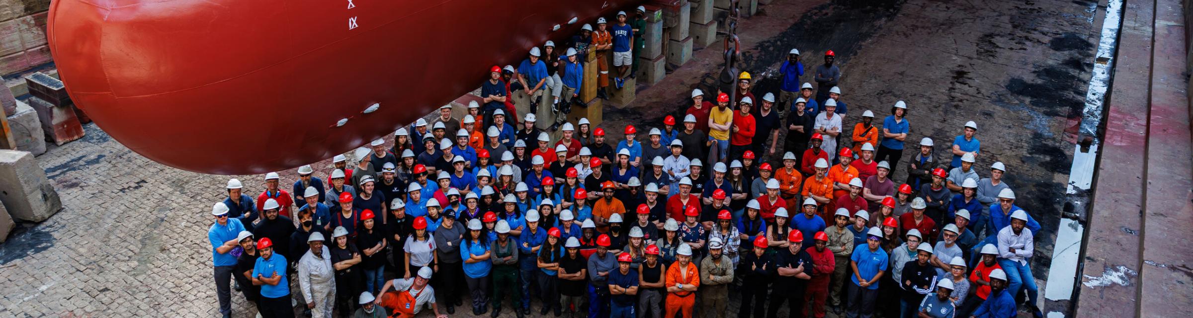 Seville, Spain :: Group photo of all of the annual maintenance workers in front of Logos Hope.