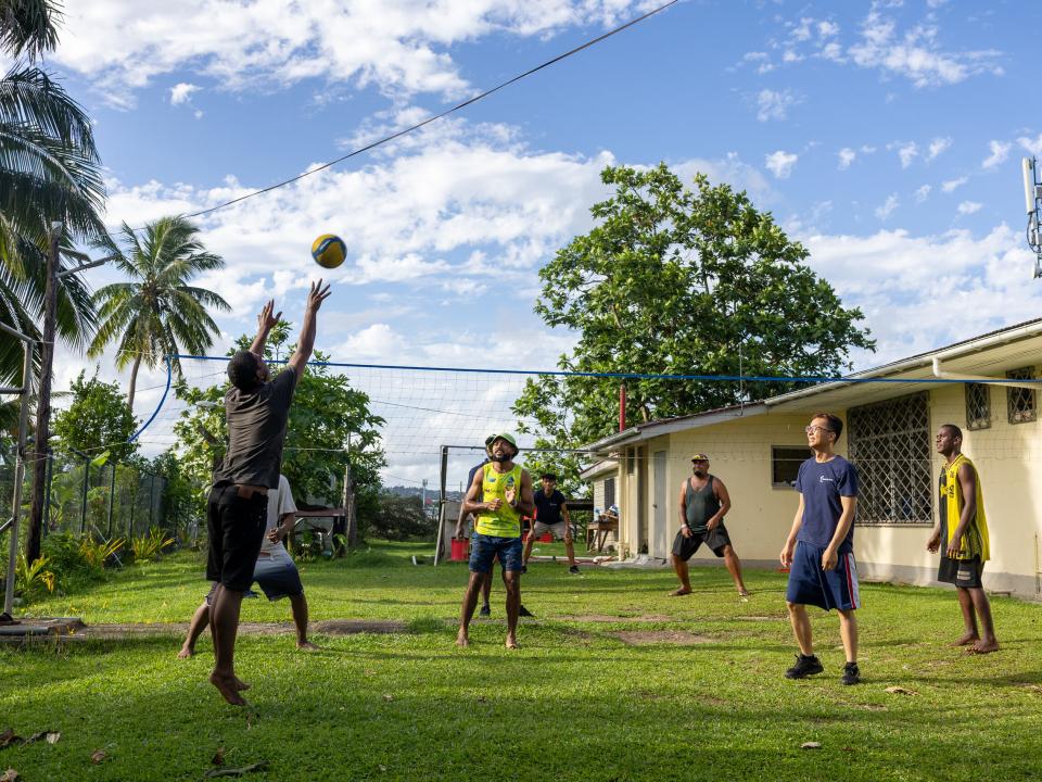 Suva, Fiji :: A crewmember plays a game with residents from a local community centre.